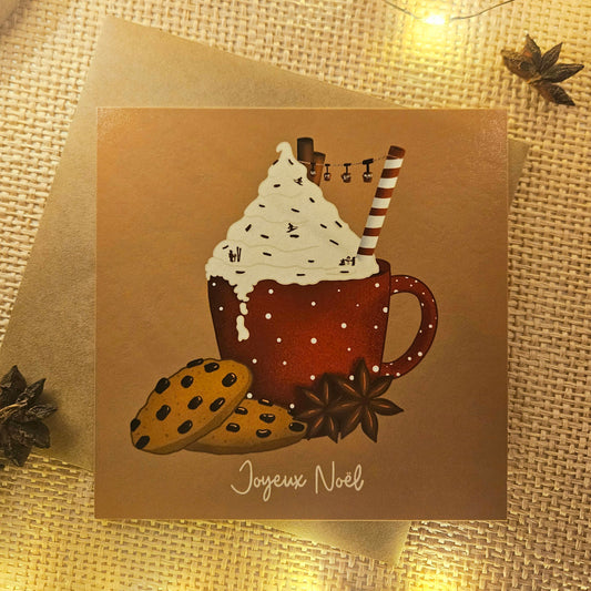 Carte de Noël représentant un chocolat chaud enneigé surmonté d’une chantilly saupoudré de skieurs