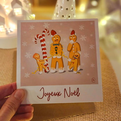 Carte de Noel représentant une famille de petits biscuits 