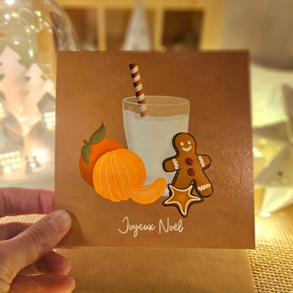 Carte de Noël représentant le goûter de Noël parfait, des clémentines, des petits biscuits et un verre de lait